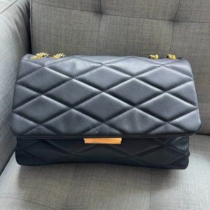 Black faux leather quilted bag with gold chain handle